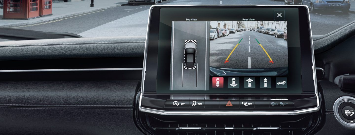 Jeep Compass — 360-degree surround-view camera with top-down and rear views plus dynamic parking guidelines.