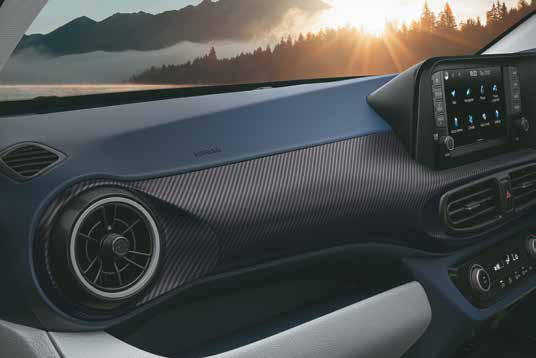 Hyundai Exter — 3D carbon-pattern dashboard finish