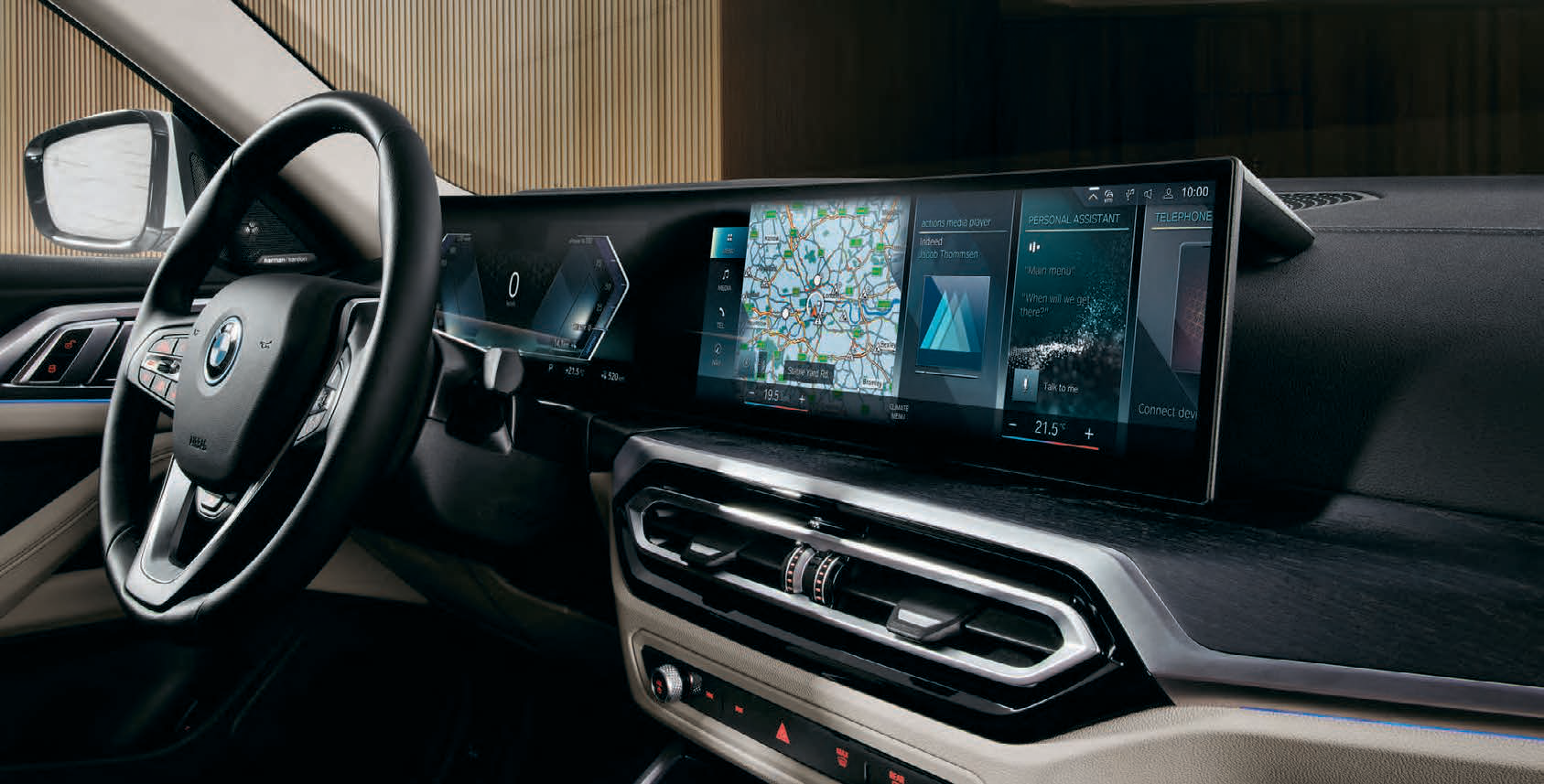BMW i4 — BMW Curved Display pairs a 12.3-inch instrument cluster with a 14.9-inch control display running iDrive Operating System 8.