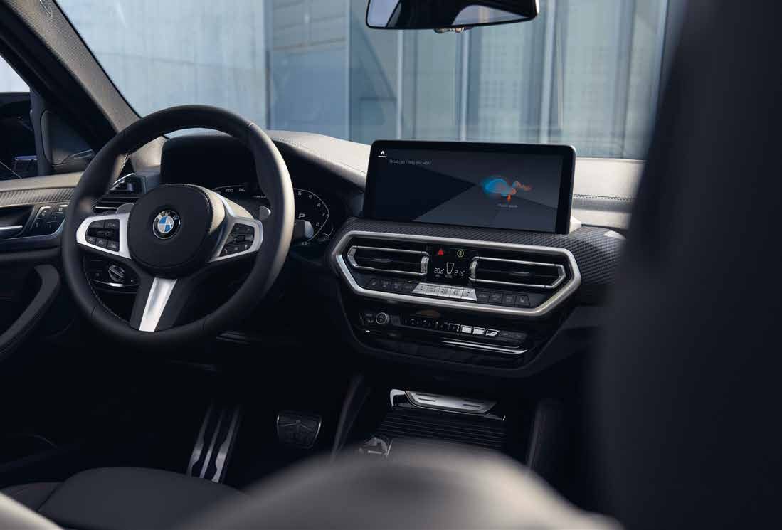 BMW X4 M40i — Driver-focused cabin with sport steering wheel
