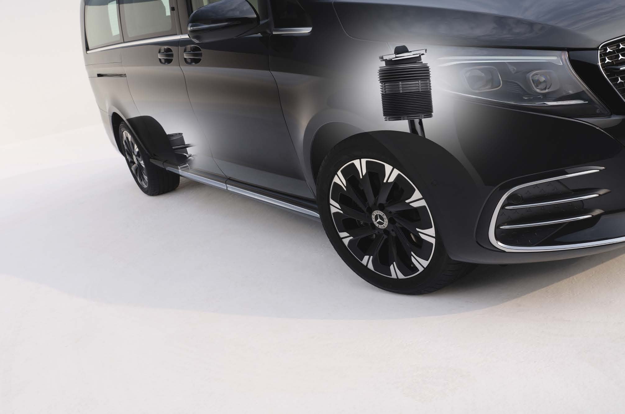Mercedes-Benz V-Class — AIRMATIC air suspension with adaptive damping, shown with the front air strut; vehicle level adjusts automatically with speed.
