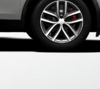 Land Rover Discovery Sport — 19-inch (48.26 cm) Style 5136 diamond-turned alloy wheel in Gloss Dark Grey, with a red brake caliper visible behind the spokes.