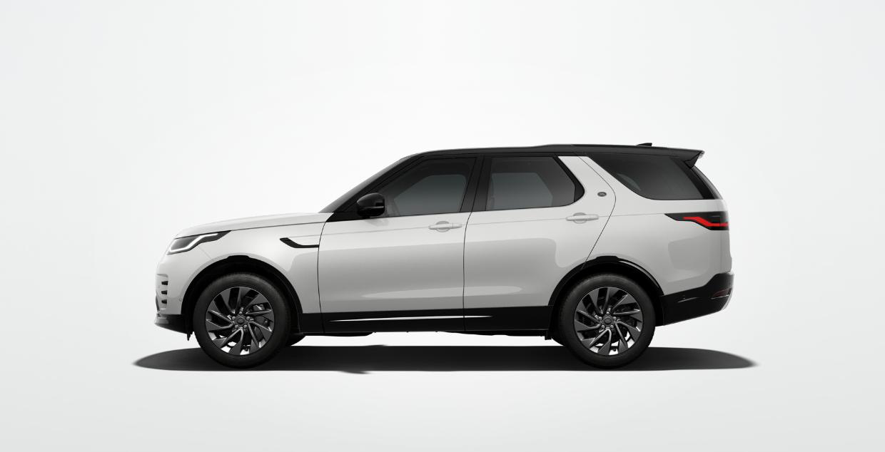 Land Rover Discovery — Side profile in Fuji White with black contrast roof and 20-inch Style 5122 Satin Dark Grey alloy wheels.