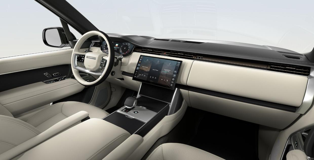 Land Rover Range Rover — Driver-oriented cabin trimmed in Perlino semi-aniline leather with a floating curved Pivi Pro touchscreen and digital driver display.
