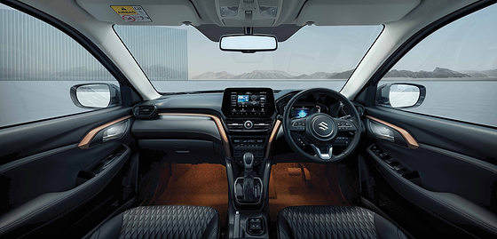 Maruti Suzuki Grand Vitara, Layered dashboard with a free-standing touchscreen, digital cluster and quilted upholstery.