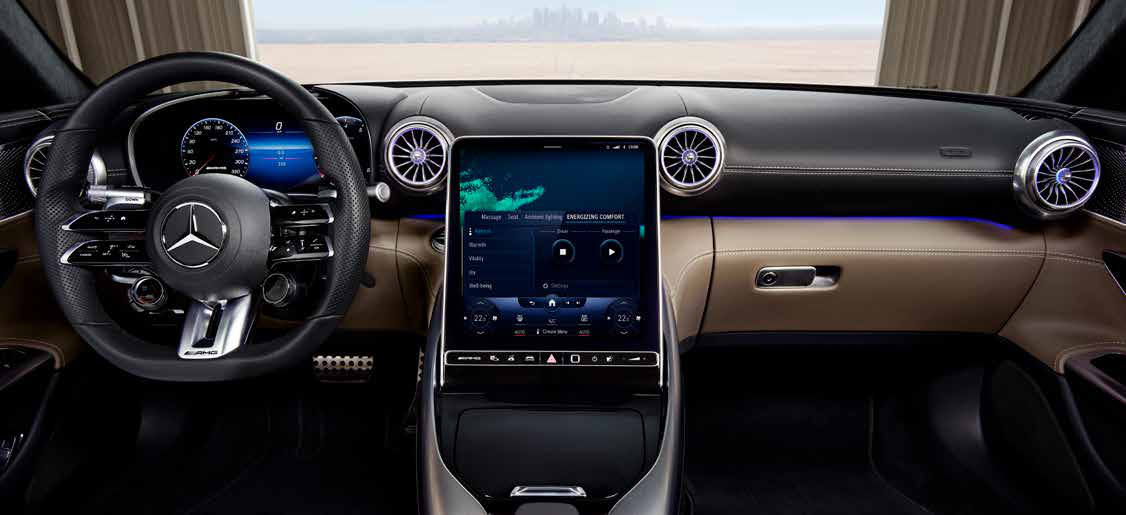 Mercedes-Benz Mercedes-AMG SL 55 Roadster — MBUX central display showing the Energizing Comfort menu, framed by turbine-style vents and ambient lighting
