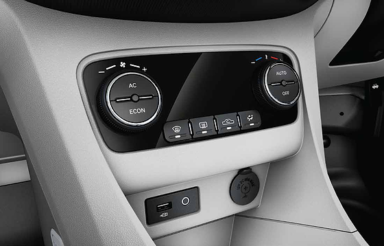 Tata Tigor EV, Fully automatic temperature control with rotary AC/ECON and AUTO dials, plus front USB port and 12V power outlet below
