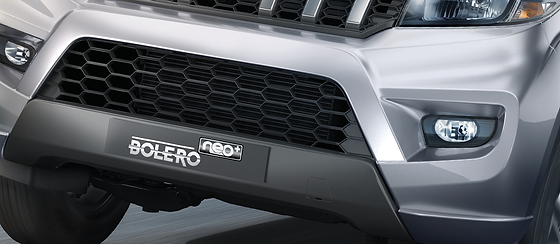 Mahindra Bolero Neo Plus, Signature X-shaped front bumper with honeycomb inserts and front fog lamps