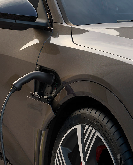 Audi Q8 e-tron, Charging connector docked into the e-tron charge port beside the front wheel.