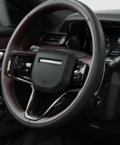 Land Rover Range Rover Velar — Leather-wrapped steering wheel with Moonlight bezel.