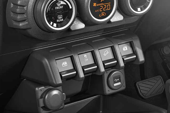 Maruti Suzuki Jimny, Centre-console switches for hill descent control and ESP off, with a USB charging port.