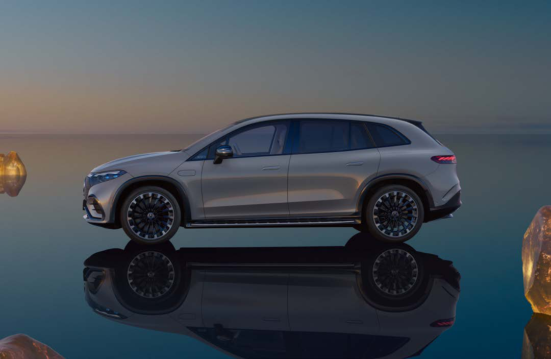 Mercedes-Benz EQS SUV — Side profile revealing the coupe-like SUV silhouette, flush pop-out door handles and aerodynamic multi-spoke alloy wheels