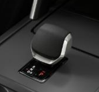 Land Rover Discovery Sport — Centre-console gear selector with P-R-N-D controls set into a piano-black panel.