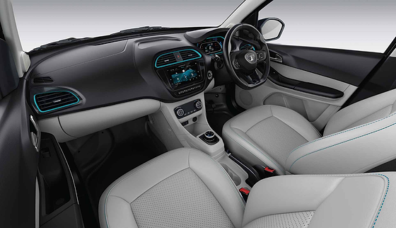 Tata Tigor EV, Dual-tone dashboard with EV-blue accents around the AC vents, floating touchscreen and digital instrument cluster