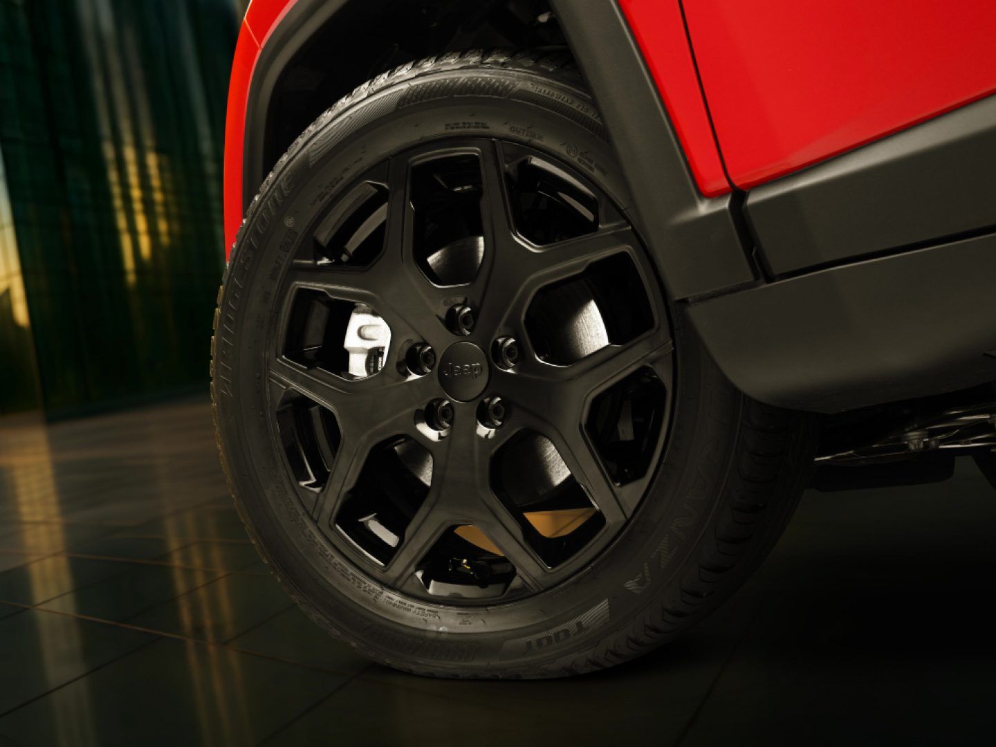 Jeep Compass — Gloss-black machined alloy wheels with a chunky spoke design.