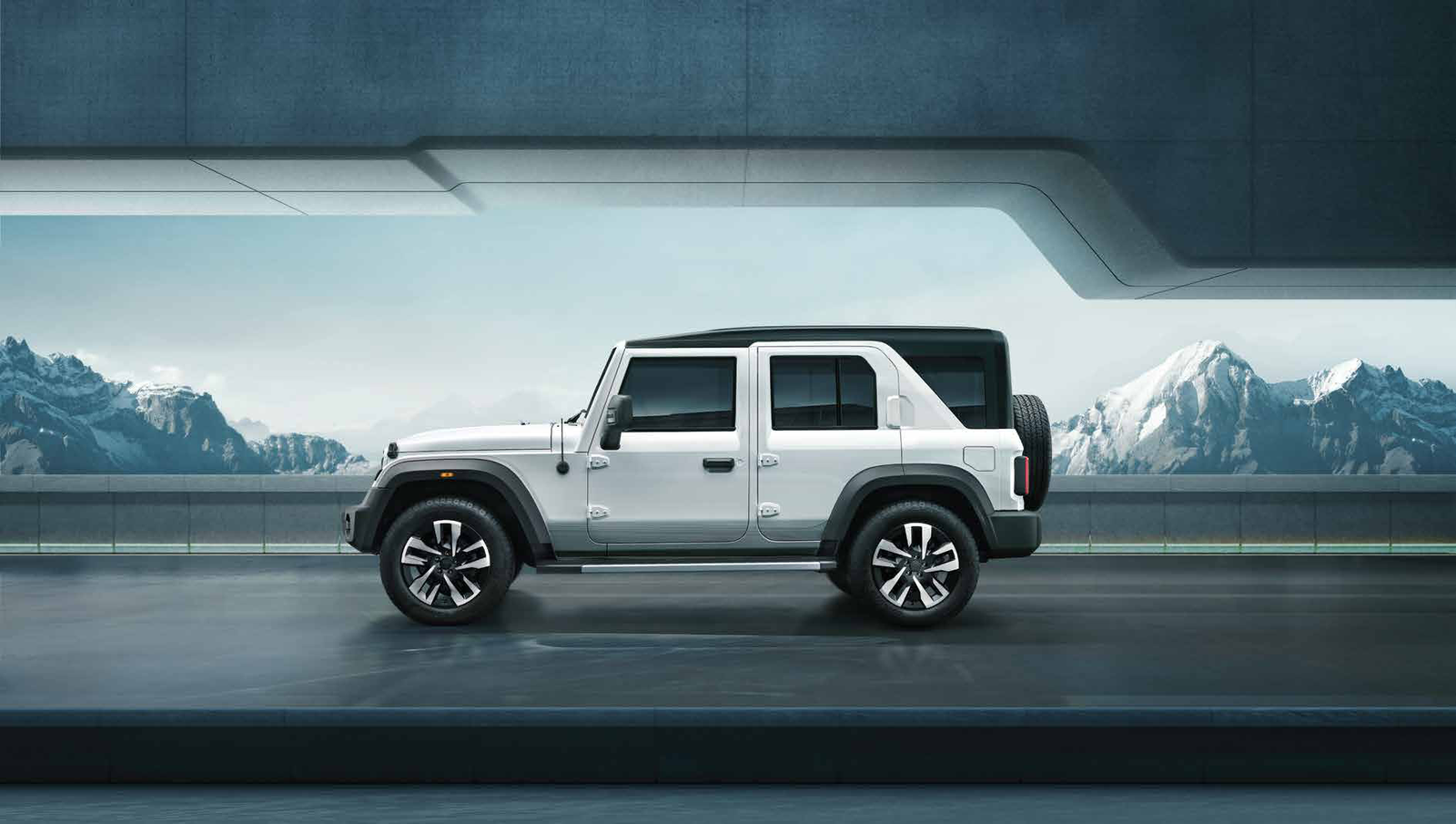 Mahindra Thar Roxx — Longer-wheelbase side profile with dual-tone metal roof and tailgate-mounted spare wheel