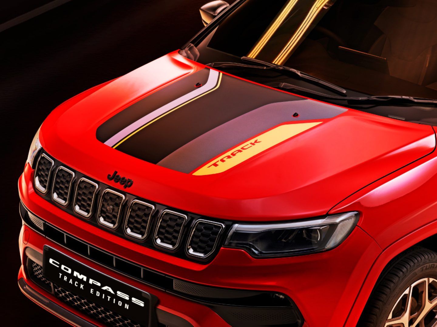 Jeep Compass — Track Edition hood graphic with gold pinstripe accents.