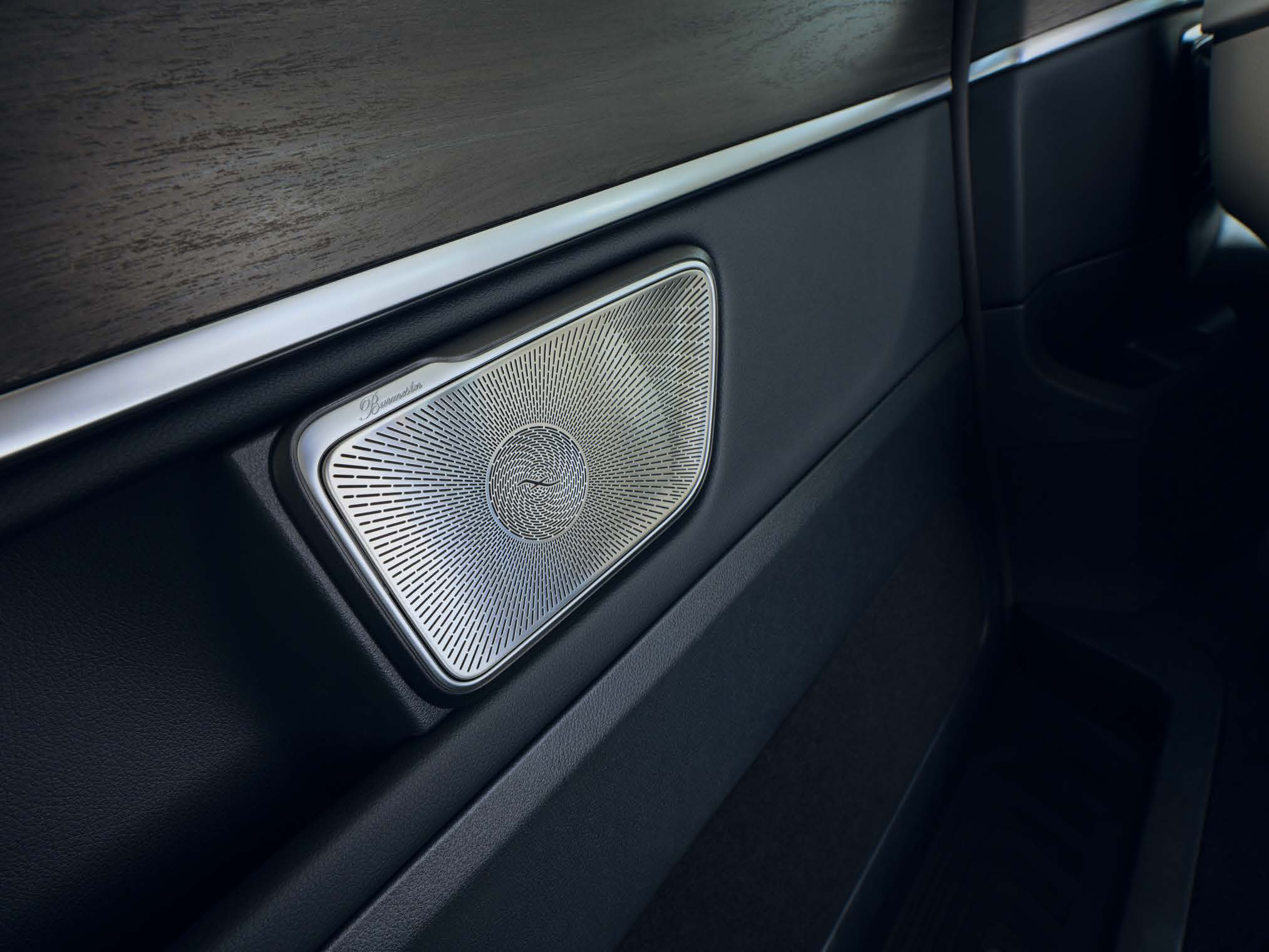 Mercedes-Benz V-Class — Burmester surround-sound speaker with signature metal grille detailing, part of the 640 W 15-speaker Dolby Atmos system.