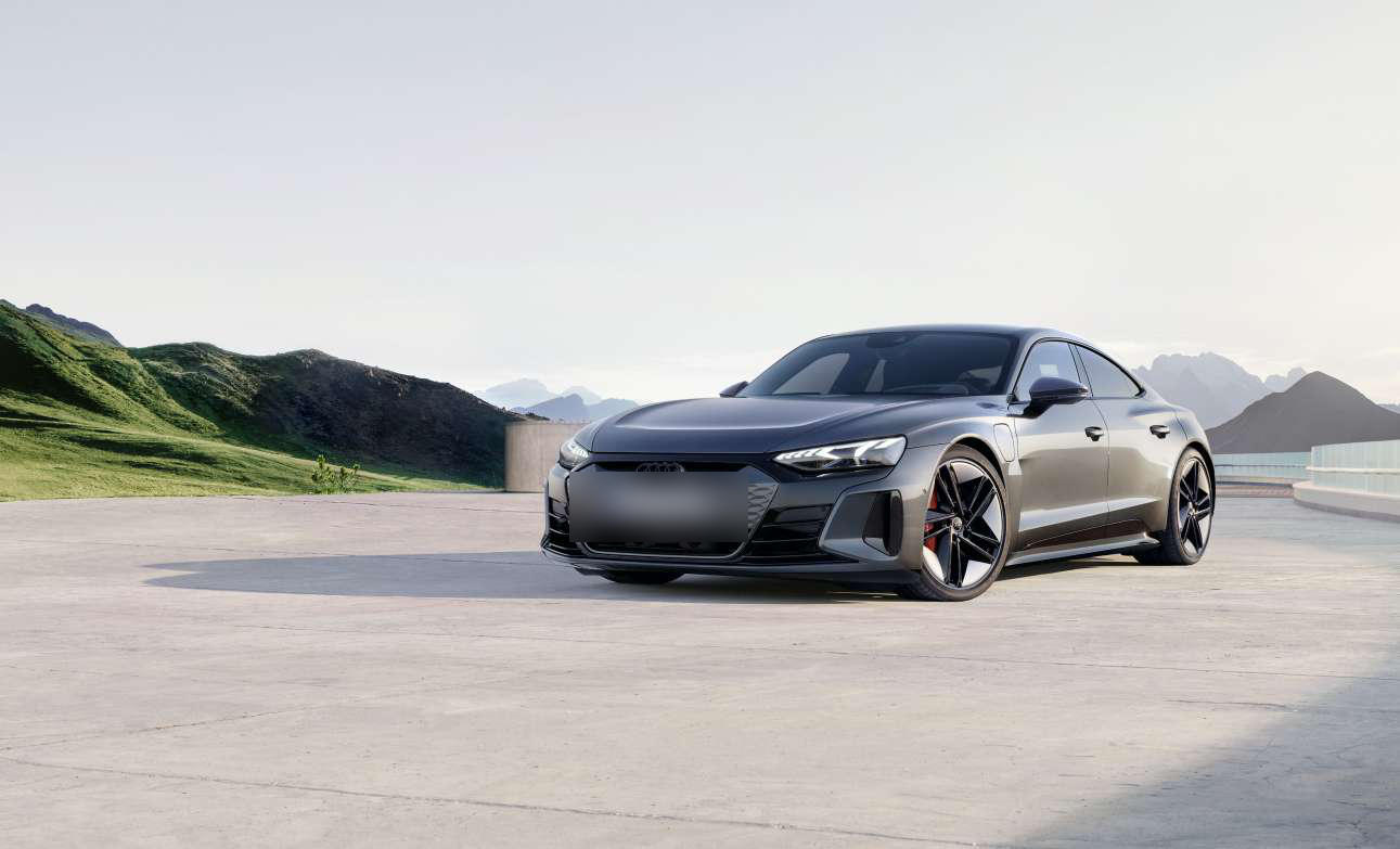 Audi e-tron GT — Audi e-tron GT front three-quarter with the body-coloured Singleframe grille and quattro blisters