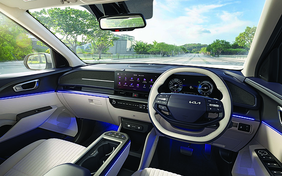 Kia Carens Clavis EV, Driver-focused cockpit with 64-colour ambient lighting and dual panoramic display
