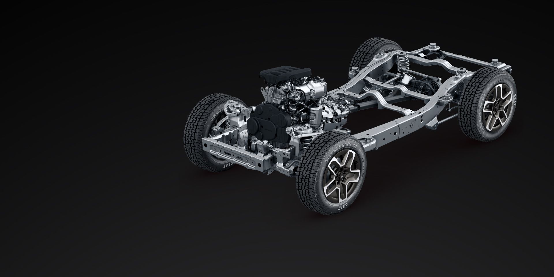 Mahindra Thar OG, Render of the complete ladder-frame chassis on a dark background with engine and gearbox, front and rear axles, coil spr