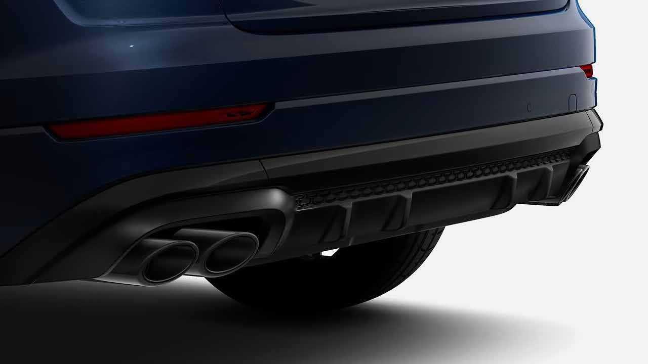 Audi SQ8 — Sculpted rear diffuser with quad tailpipes.