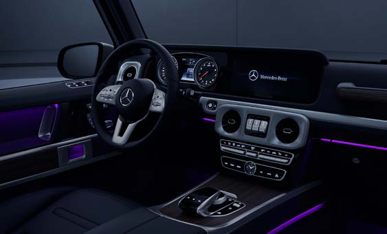 Mercedes-Benz G-Class — Ambient interior lighting bathing the dashboard and door trims in colour, selectable across multiple shades