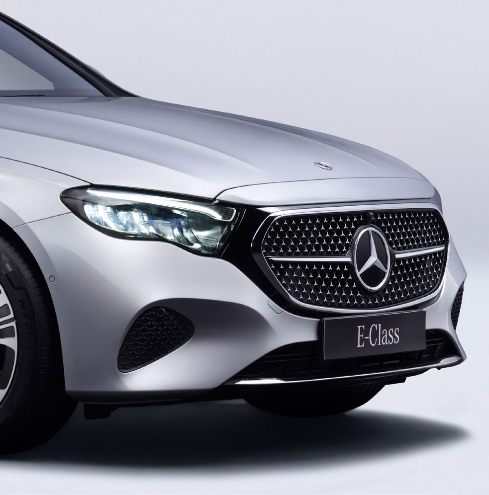 Mercedes-Benz E-Class — AMG Line front with diamond-block radiator grille and central Mercedes star