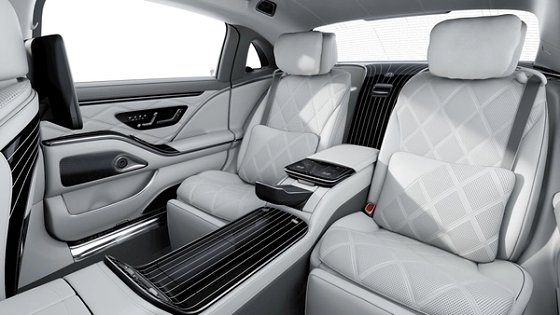 Mercedes-Benz Mercedes-Maybach S-Class, The first-class rear compartment in Maybach Exclusive Nappa crystal white and silver grey pearl, with the fold-out tables and the centre console tablet.