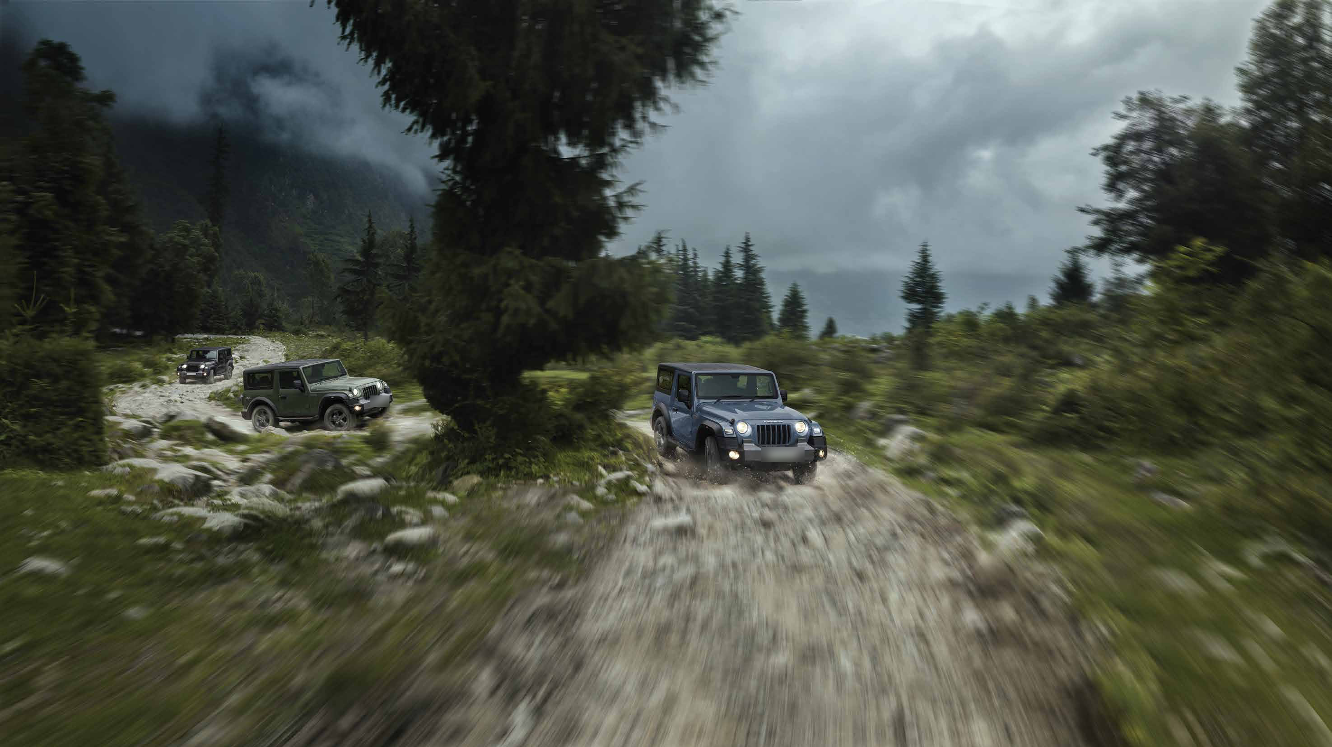 Mahindra Thar — Thar convoy powering up a rocky Himalayan trail with 4x4 capability