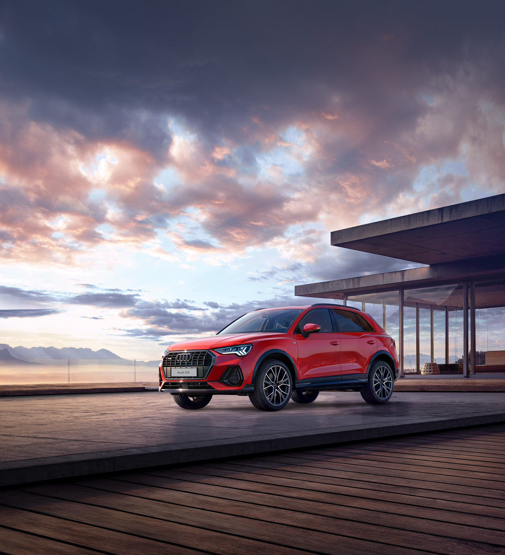 Audi Q3 — Single-frame grille with vertical struts flanked by slim LED headlights on the front of the Audi Q3.