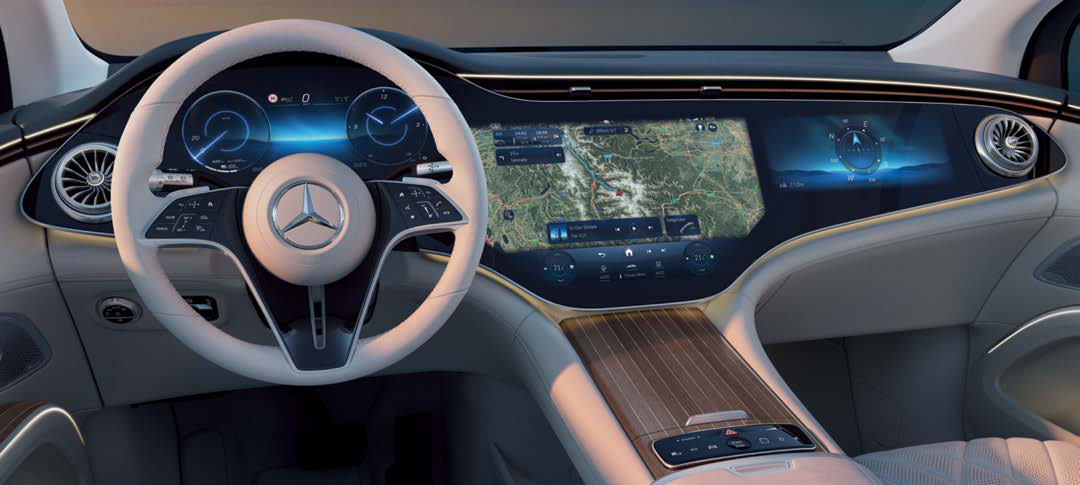 Mercedes-Benz EQS SUV — MBUX Hyperscreen spanning the driver display and central OLED touchscreen with live map navigation