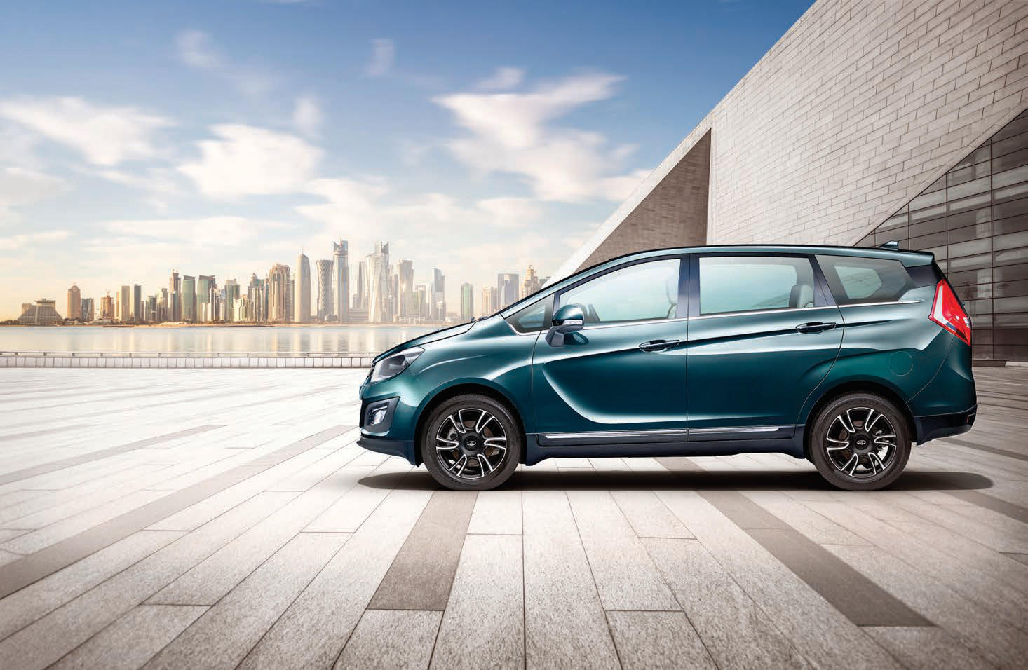 Mahindra Marazzo — Aerodynamic MPV silhouette with chrome window beltline and roof spoiler