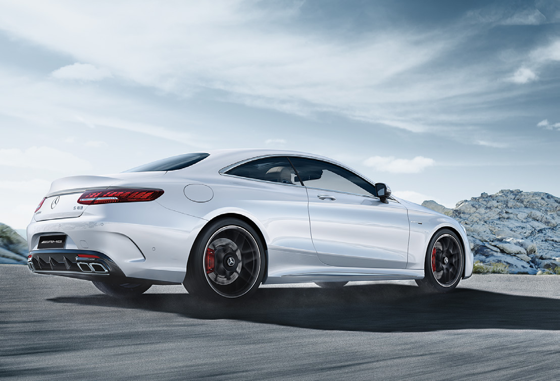 Mercedes-Benz Mercedes-AMG S 63 E Performance — Rear three-quarter view showing the wraparound LED tail lamps, AMG rear diffuser and quad tailpipes