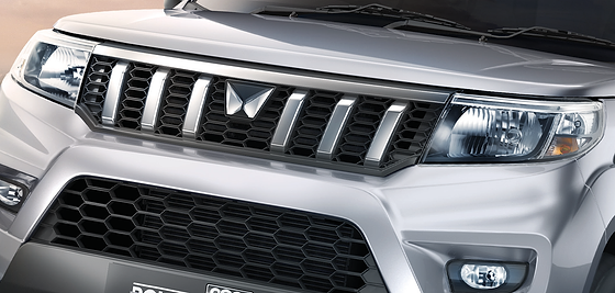 Mahindra Bolero Neo Plus, Signature grille with chrome inserts, flanked by twin-pod headlamps
