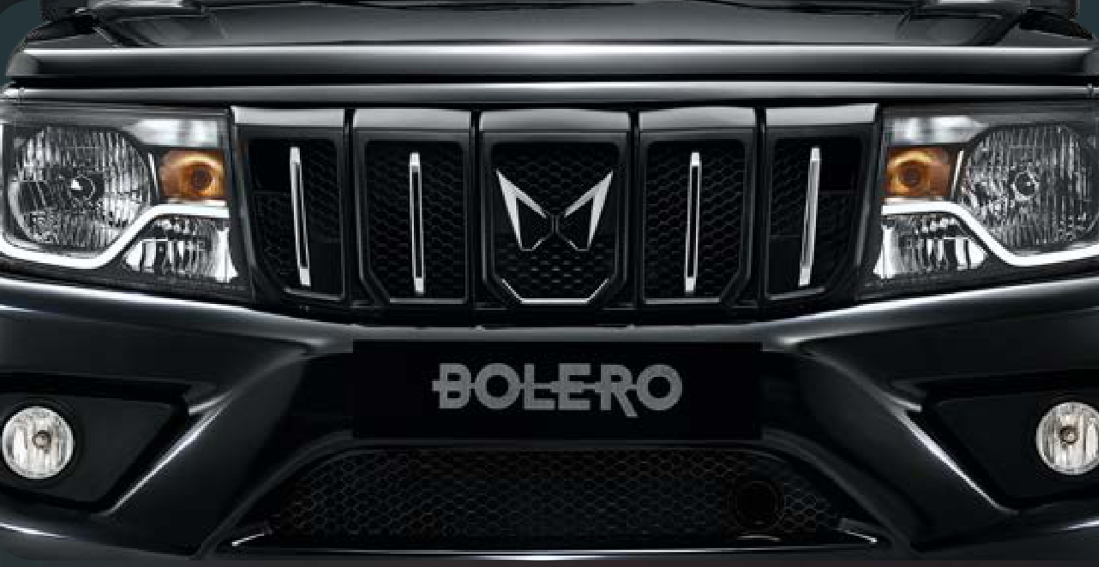 Mahindra Bolero — Bold new front grille with chrome-accented vertical slats and twin-peaks logo