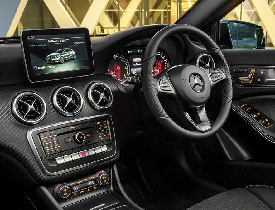 Mercedes-Benz Mercedes-AMG A45 S — Driver-oriented dashboard with a free-standing central display, turbine-style air vents and a multifunction steering wheel.