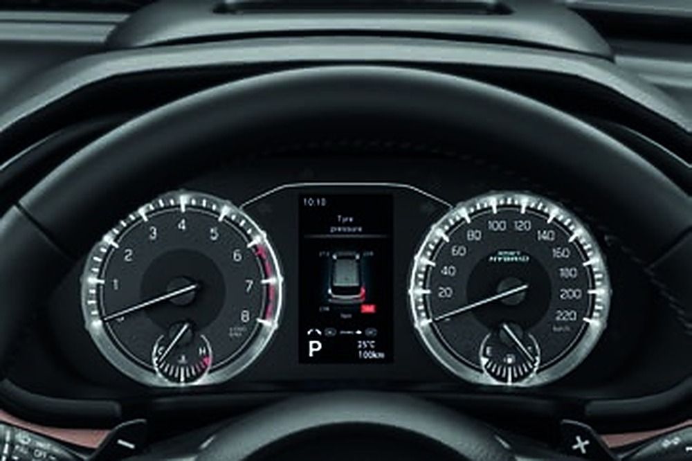 Maruti Suzuki Brezza — Analogue dials flanking a colour TFT multi-information display.