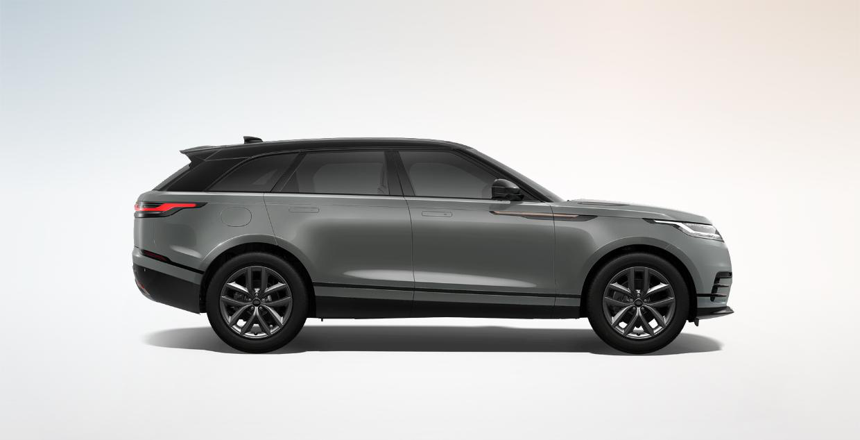Land Rover Range Rover Velar — Side profile on 20-inch alloy wheels with flush deployable door handles.