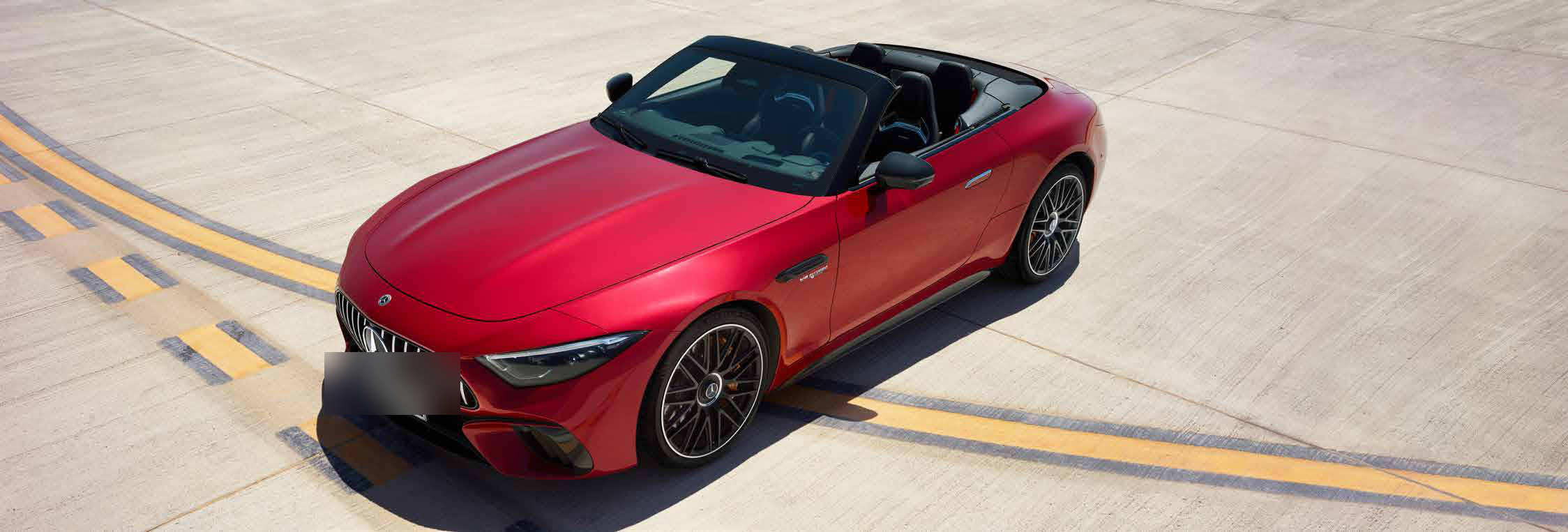 Mercedes-Benz Mercedes-AMG SL 55 Roadster — Top-down view of the SL roadster with the fabric roof lowered, showing the 2+2 open cabin