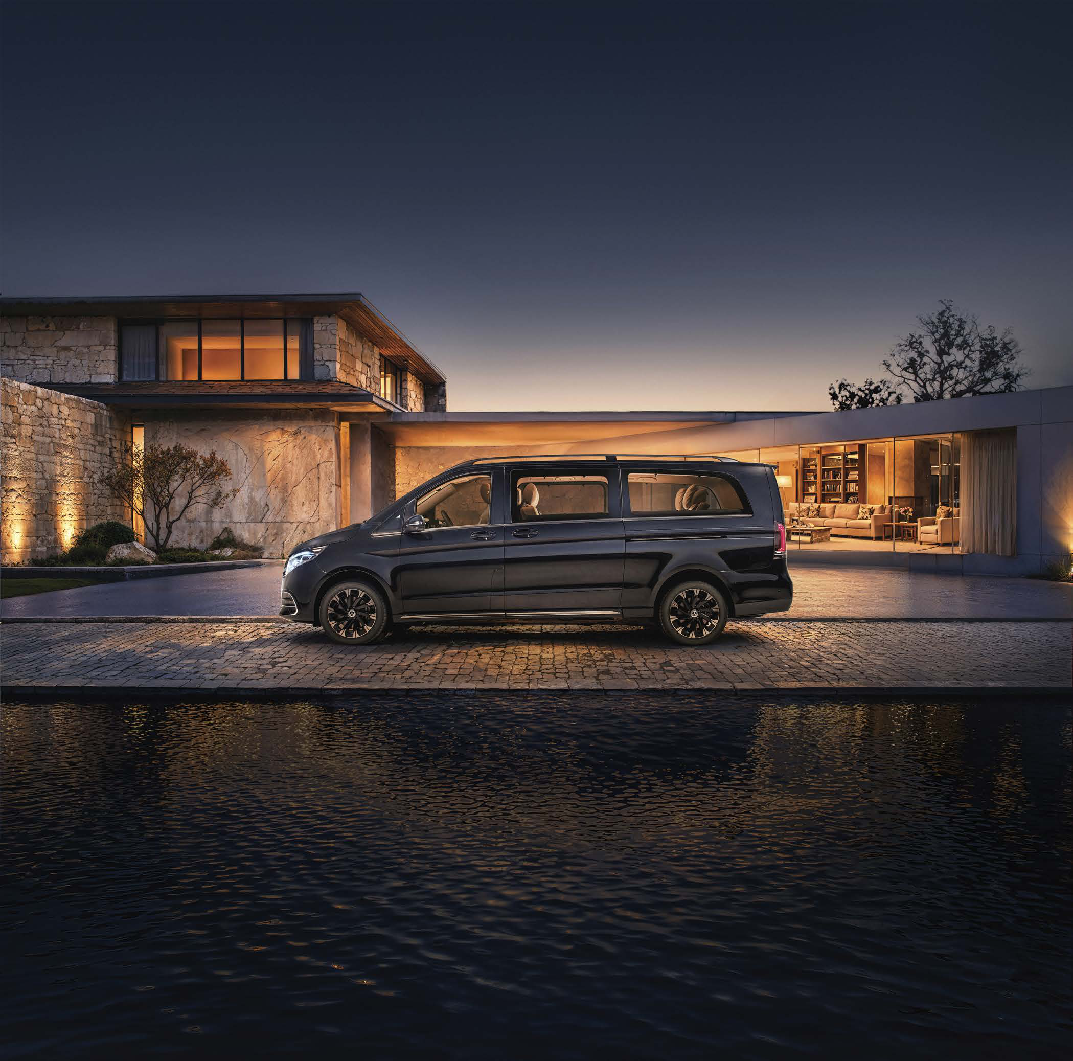 Mercedes-Benz V-Class — Extra-long-wheelbase silhouette in Obsidian Black, showing the full side profile with roof rails and multi-spoke alloy wheels.