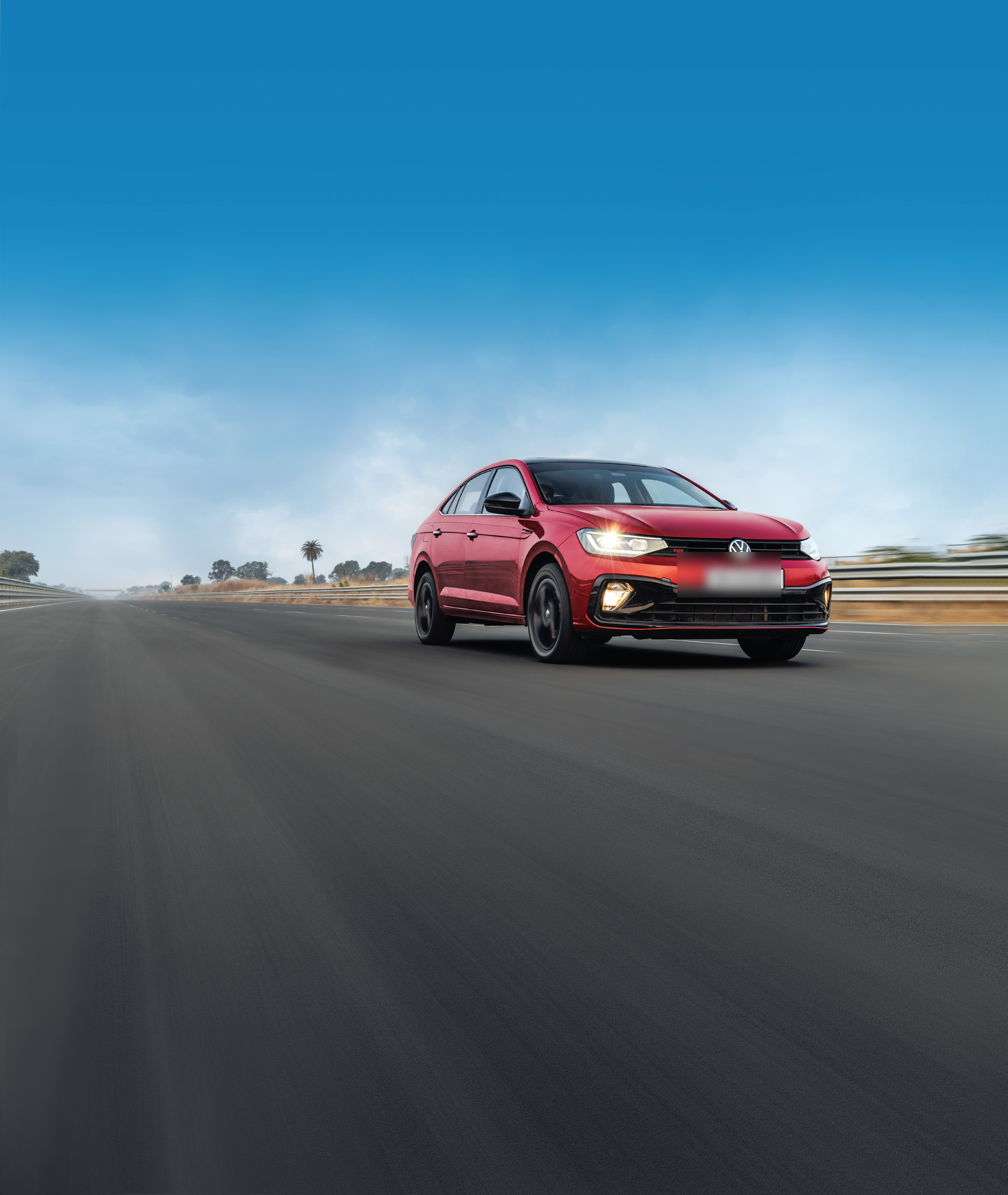 Volkswagen Virtus — Virtus GT at speed, showing the LED headlamps and sporty GT front styling.