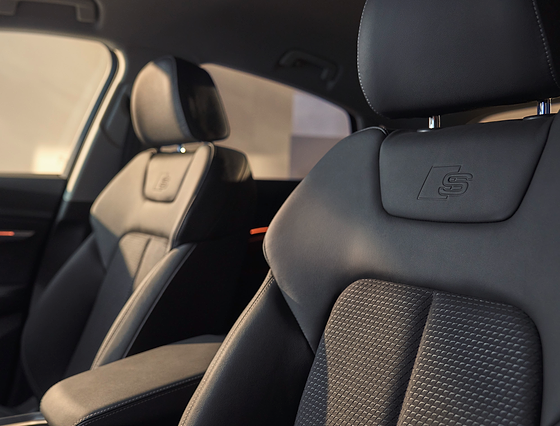 Audi Q8 Sportback e-tron, S line sport seats with embossed S logo on the headrests
