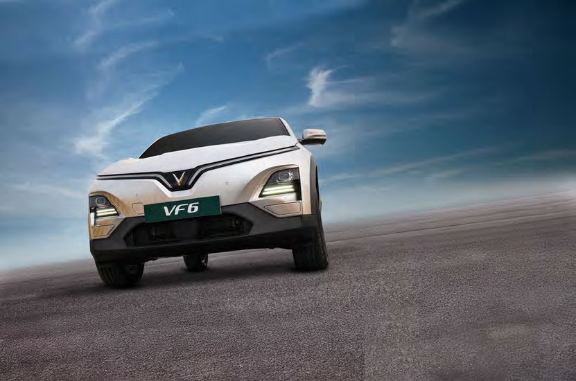 VinFast VF 6 — Clean SUV profile with R18 machine-cut alloy wheels and roof rails