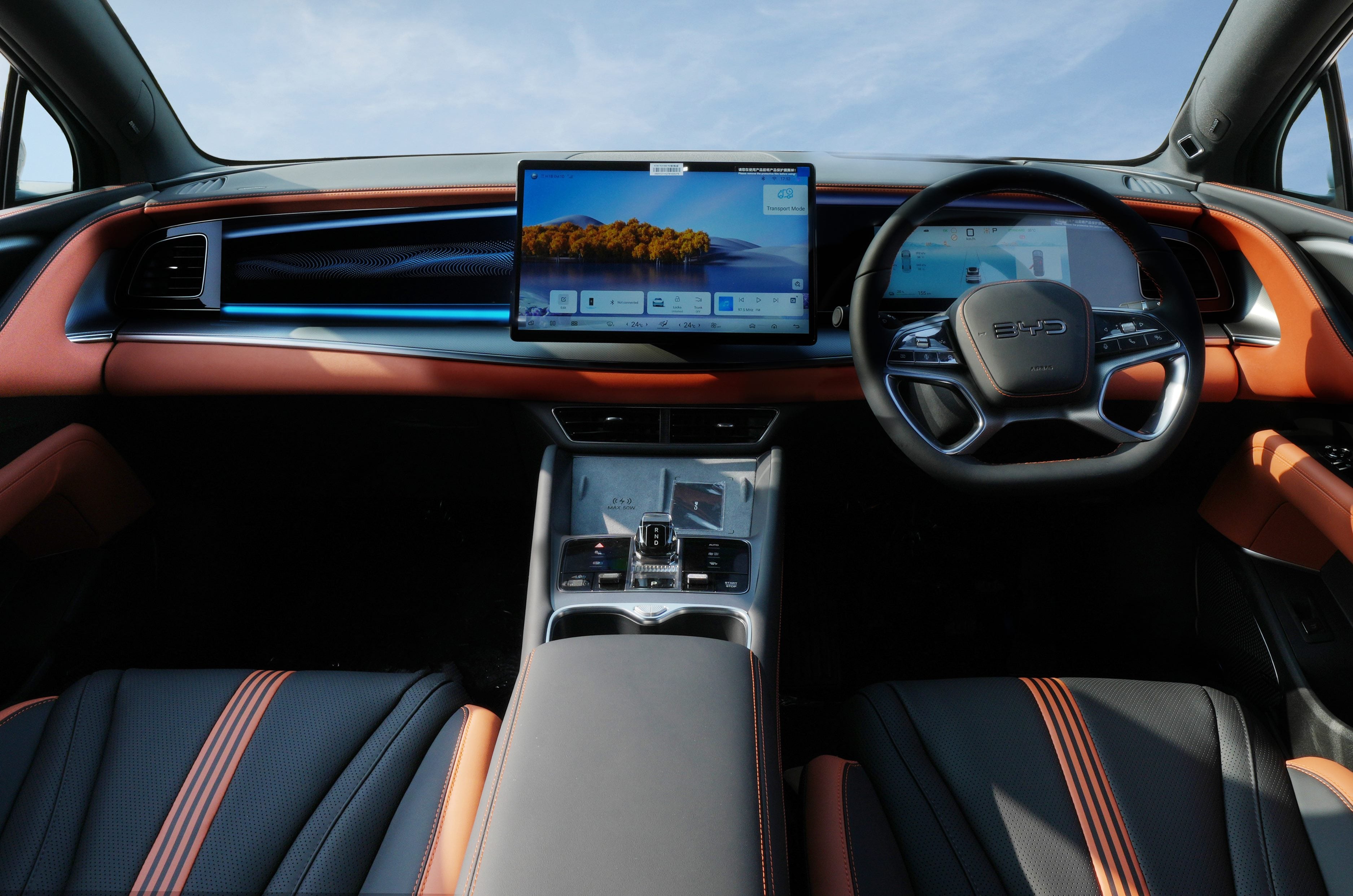 BYD Sealion 7, Festive Edition: tan and black dashboard and door cards around the 15.6-inch rotating screen