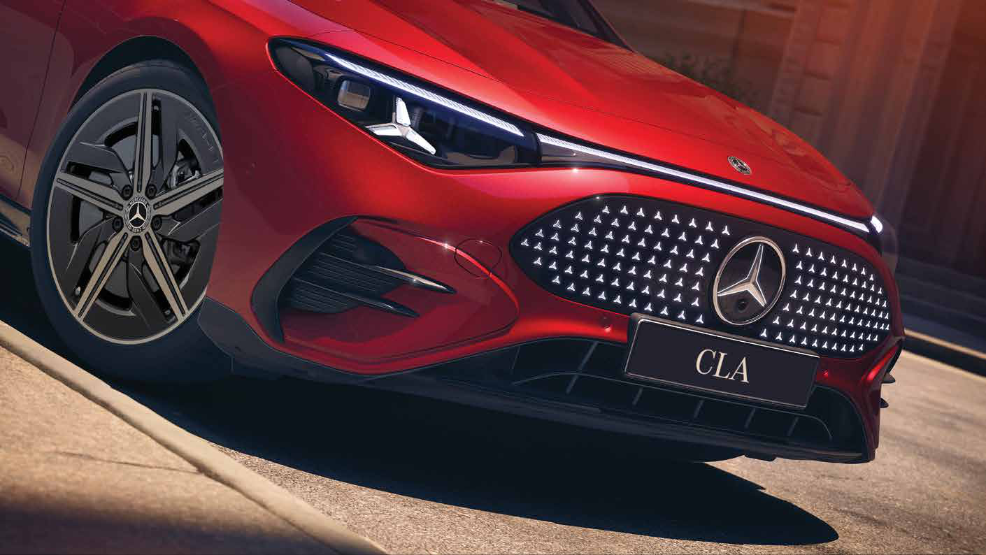 Mercedes-Benz CLA Electric — Illuminated star-pattern grille with central Mercedes star and digital LED headlamps.
