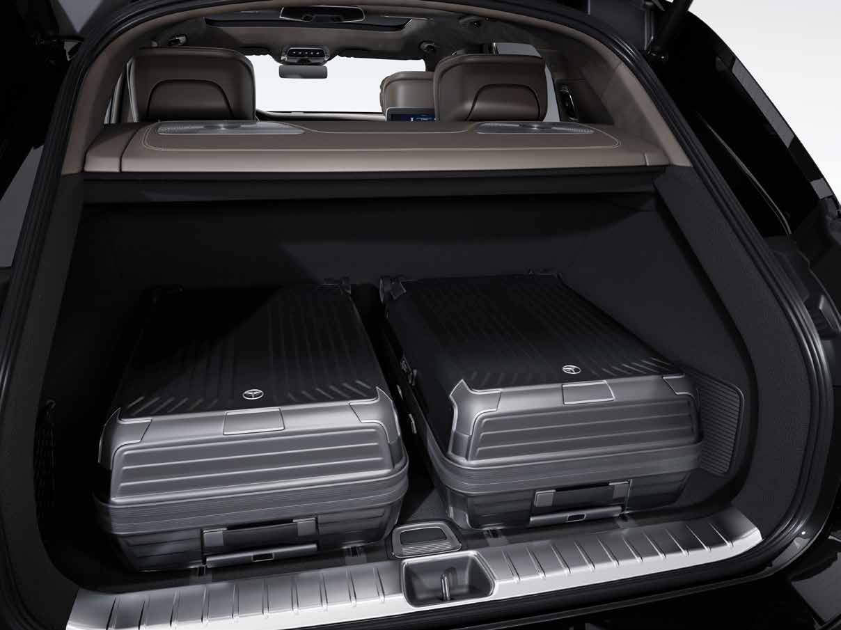 Mercedes-Benz Mercedes-Maybach EQS SUV — Luggage compartment with fitted Maybach hard-shell cases under the load cover