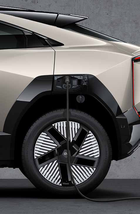 Mahindra BE 6, Side charging port shown with the connector plugged in for DC fast charging