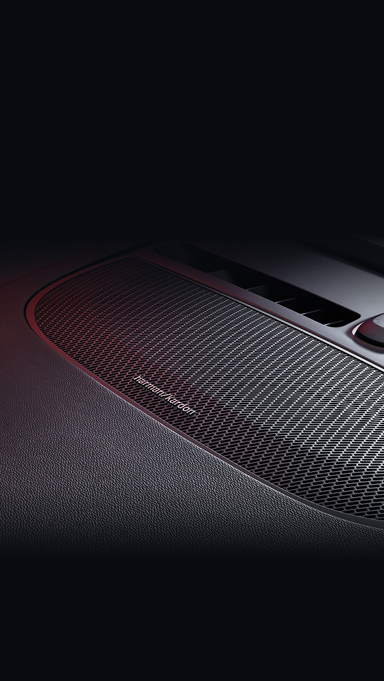 Volvo EC40, Harman Kardon premium sound system speaker grille integrated into the dashboard.