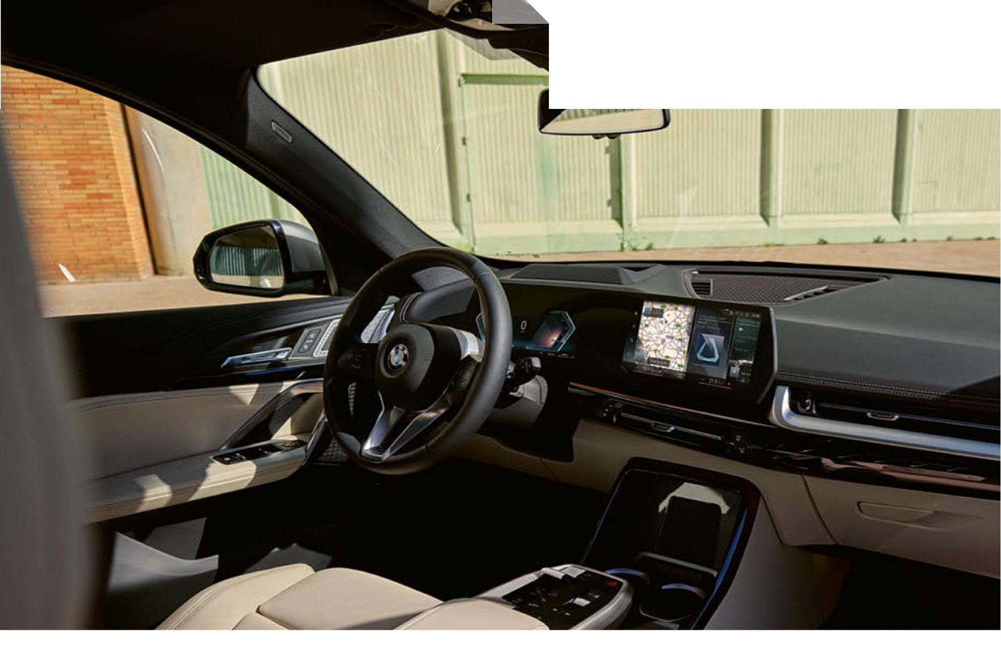BMW iX1 — Driver-focused cockpit with curved display and floating centre console